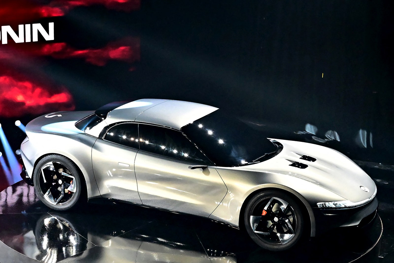 The allelectric 4door Convertible GT Fisker Ronin is revealed on stage during its inaugural Product Vision Day