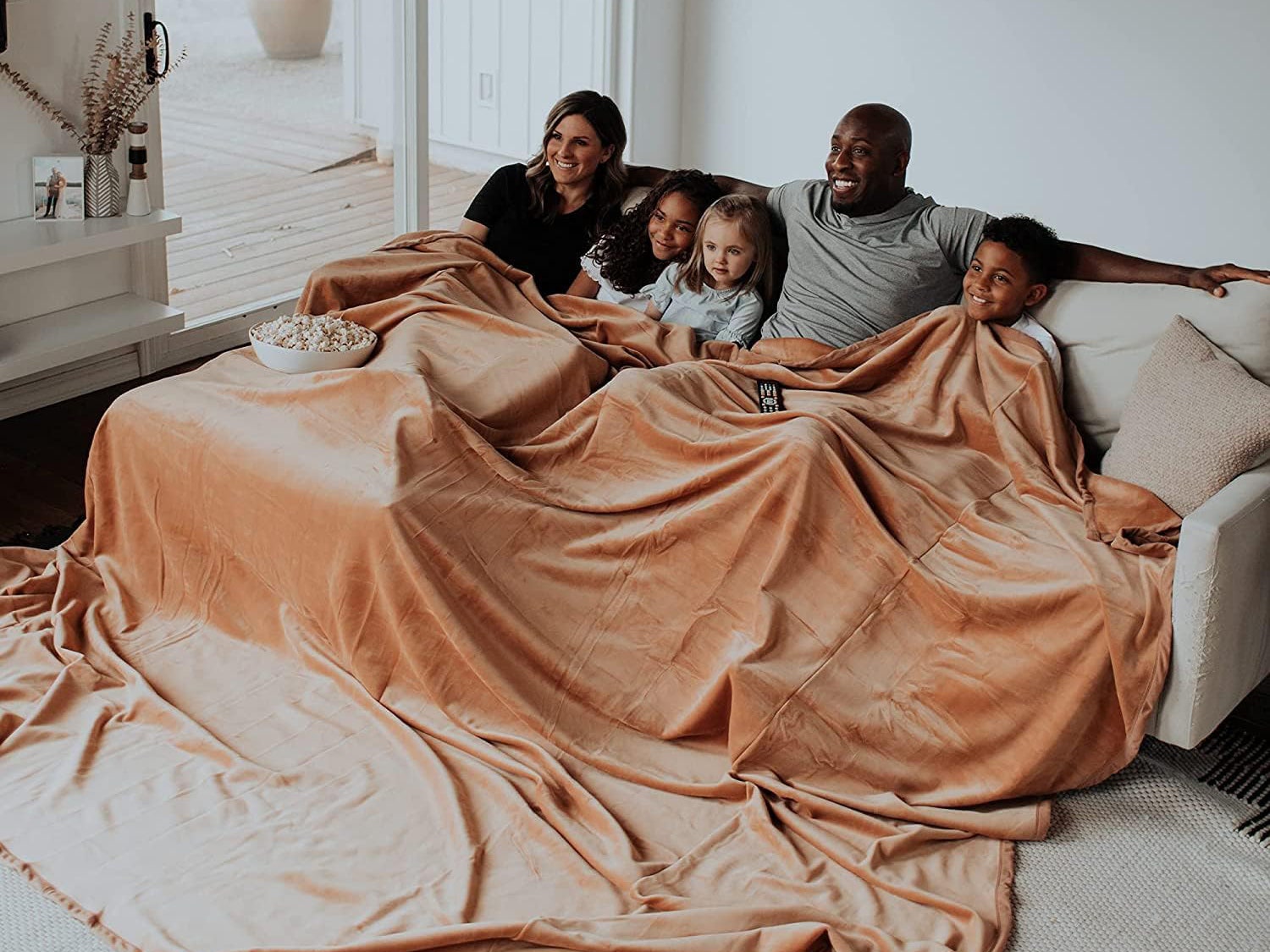 Family using the Big Blanket Co. blanket
